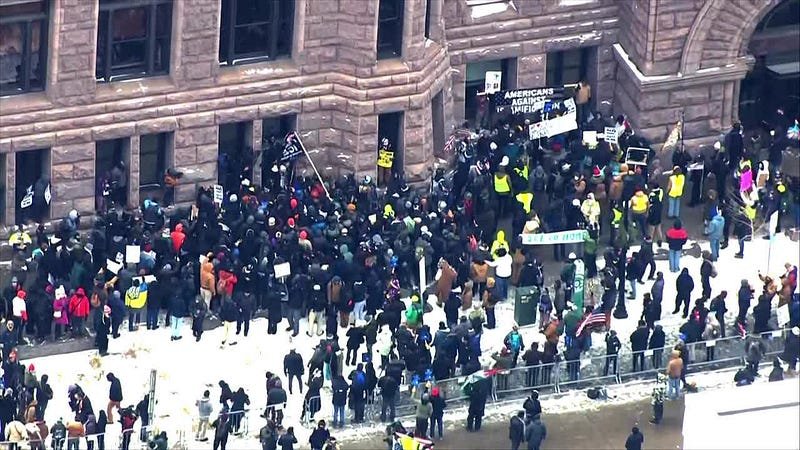 Tensions rise in Minneapolis as right-wing influencer faces counter-protest